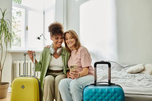 Two partners share a joyful moment while planning a trip. — Stock Photo