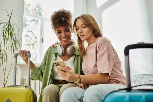 Two happy individuals share a moment while planning their adventure together. — Stock Photo