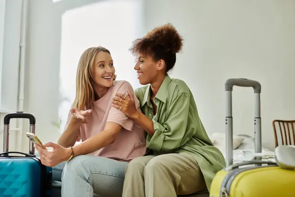 Couple shares laughter and warmth while surrounded by travel bags. — Stock Photo