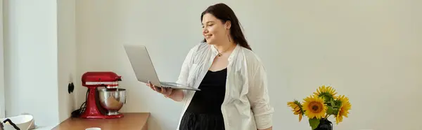 A cheerful woman in casual attire enjoys her time working remotely at home. — Stock Photo