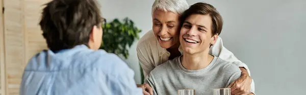 A loving LGBTQ family enjoys breakfast together, sharing smiles and laughter — Stock Photo