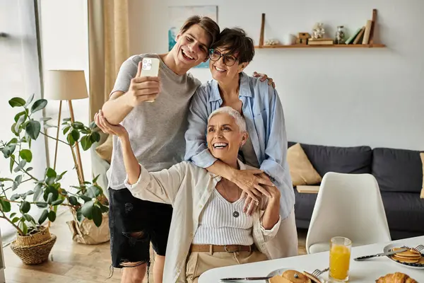 A loving LGBTQ family enjoys breakfast together, sharing laughter and creating cherished moments. — Stock Photo