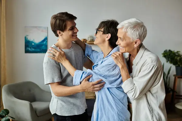 A lesbian family enjoys a warm and joyful moment, connecting with laughter and love in their inviting home. — Stock Photo