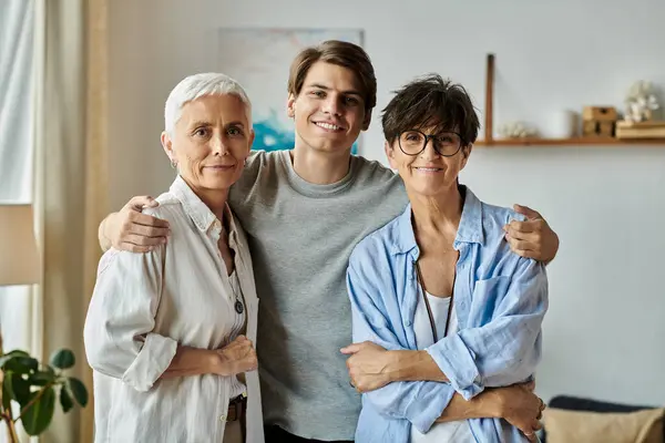 A loving LGBTQ family enjoys precious moments together, sharing smiles and hugs in their welcoming home. — Stock Photo