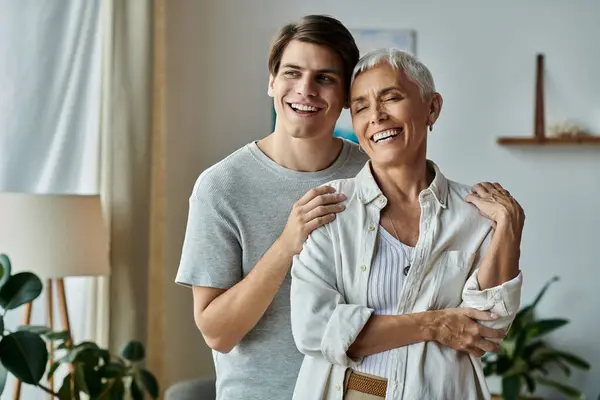 A mother and her adult son share laughter and warmth, cherishing their quality time together. — Stock Photo