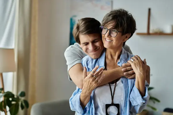 A mother and son share laughter and affection while enjoying quality time together at home. — Stock Photo