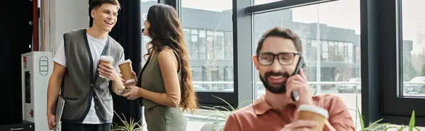 Colleagues interact casually while in modern office. — Stock Photo
