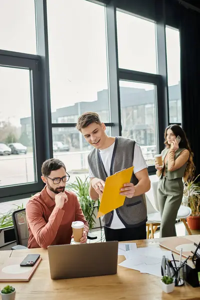Colleagues engage in discussion in modern office. — Stock Photo