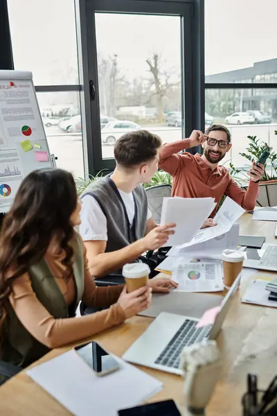 Colleagues share light moments in a stylish office setting. — Stock Photo