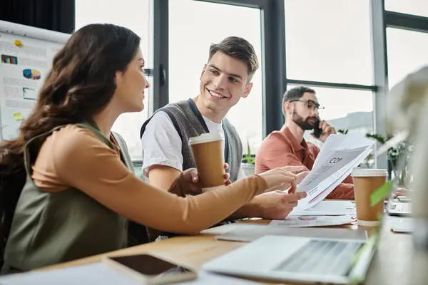 Colleagues share a light moment in office. — Stock Photo