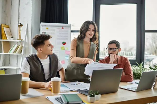 Colleagues engage in a serious discussion in an open workspace. — Stock Photo