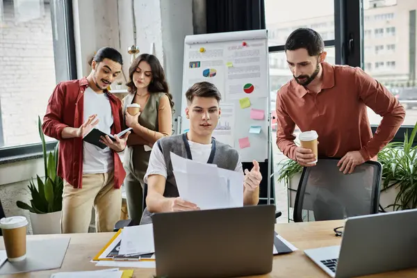 Team members converse while at workplace. — Stock Photo