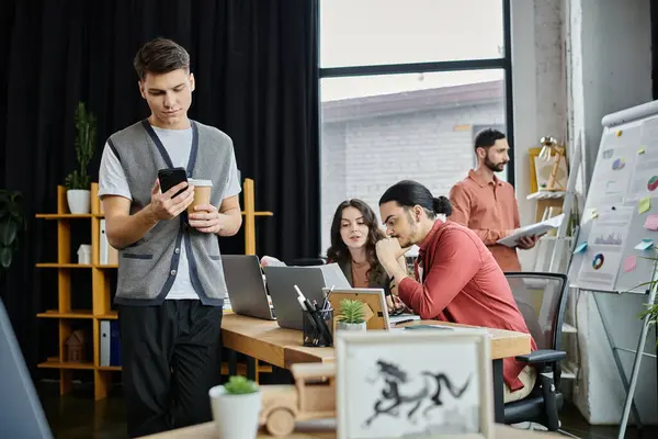 Colleagues engaged in discussions at modern workplace. — Stock Photo