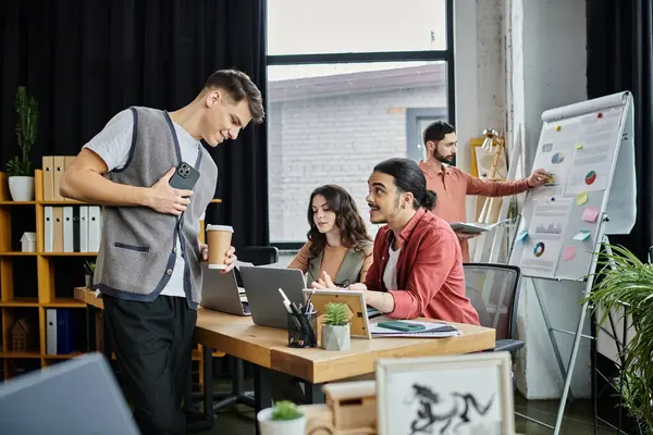 Team members interact casually while in modern office. — Stock Photo