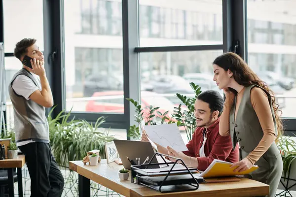 Three colleagues working together in office. — Stock Photo