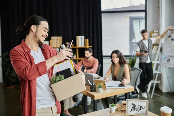 Friendly colleagues share a moment amid the layoff process in a modern workspace. — Stock Photo