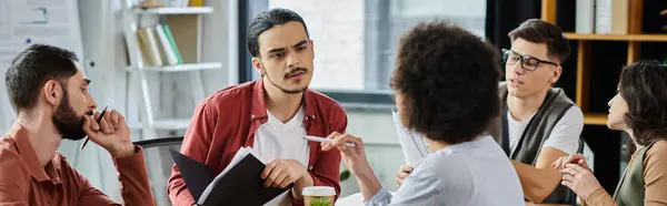 Team members share thoughts and emotions amid challenging circumstances. — Stock Photo