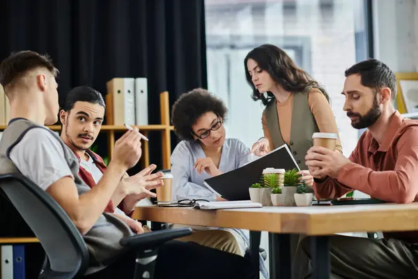 Professionals engage in a serious discussion about their work. — Stock Photo