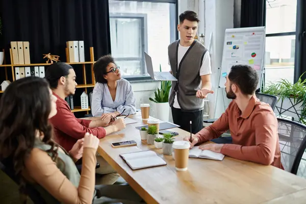 Colleagues converse in a modern setting during their work. — Stock Photo