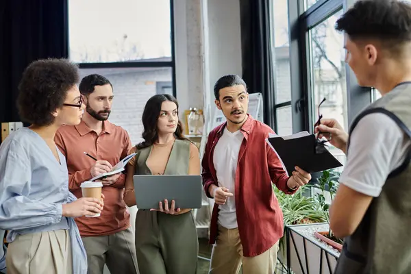 Colleagues converse thoughtfully while at their work. — Stock Photo