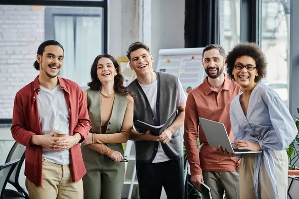 Supportive team members gather together, sharing smiles amid a difficult transition. — Stock Photo
