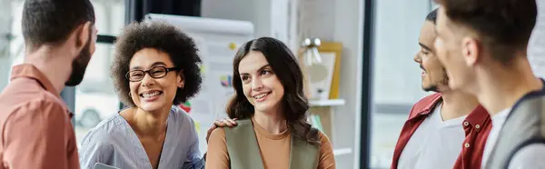 Good looking colleagues share smiles and support amidst a challenging layoff process. — Stock Photo