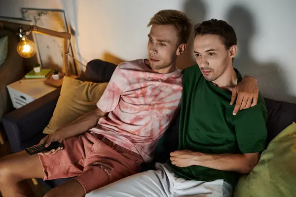 Two men share a quiet, affectionate moment while relaxing together. — Stock Photo