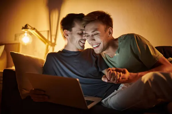 Two men share laughter and warmth while spending cozy time together. — Stock Photo