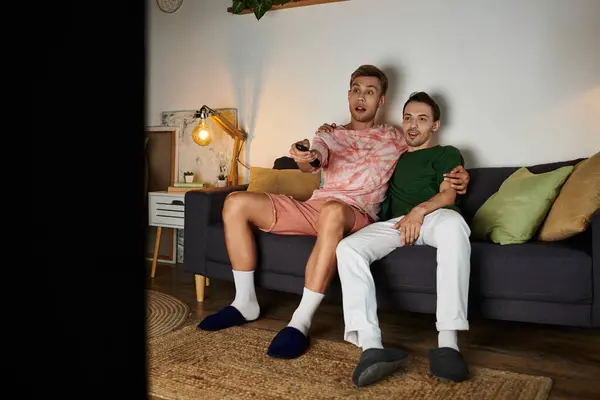 A loving couple shares laughter while watching a movie. — Stock Photo