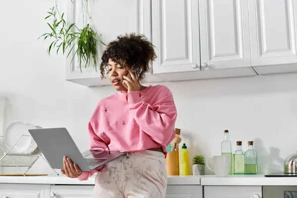 A young woman is engaged in a lively phone conversation at home. — Stock Photo