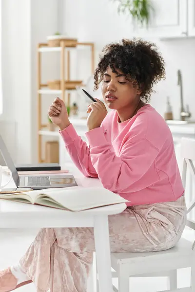 A young woman savors a moment of creativity while working at home. — Stock Photo