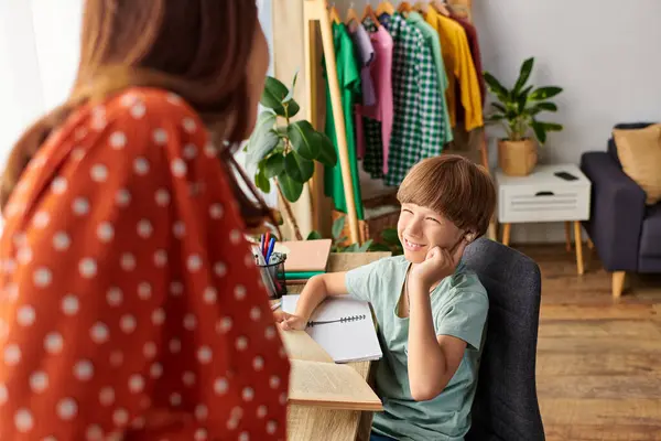 A mother shares a delightful time with her hearing impaired son, fostering connection. — Stock Photo