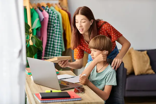 A mother lovingly engages her son in a learning activity. — Stock Photo