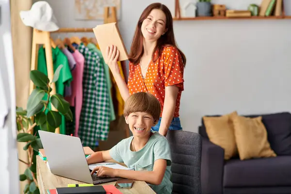 A mother shares a joyful moment with her hearing impaired son, both smiling. — Stock Photo