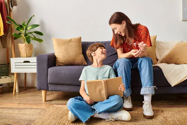 A mother and her hearing impaired son share a joyful learning moment at home. — Stock Photo