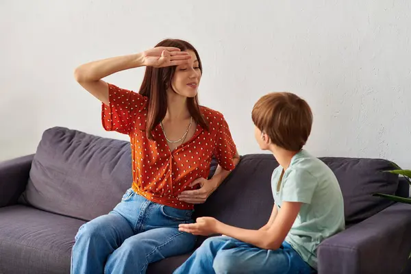 A mother and her hearing impaired son enjoy a joyful conversation together. — Stock Photo
