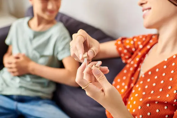 A mother and her son engage in a playful activity together. — Stock Photo