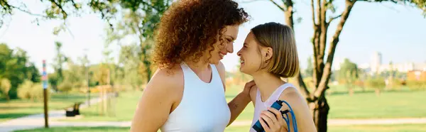 A couple shares a tender moment, laughing under the warm sun. — Stock Photo