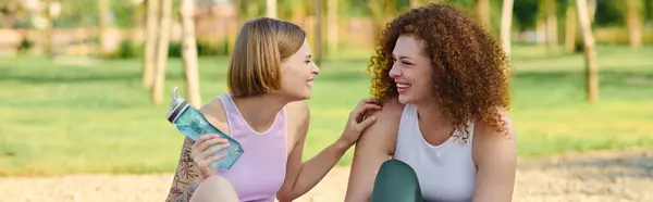 A loving couple enjoys playful moments together under the trees. — Stock Photo