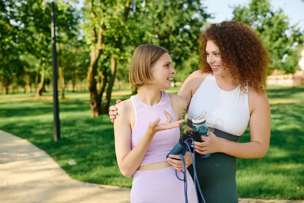 Two women share laughter and joy while spending quality time outdoors. — Stock Photo