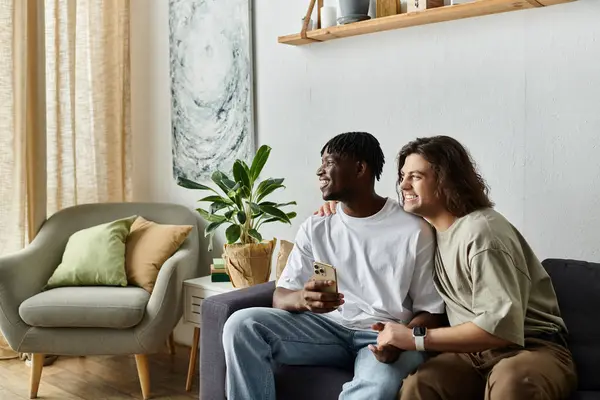 Two partners enjoy each other while relaxing in their inviting home space. — Stock Photo