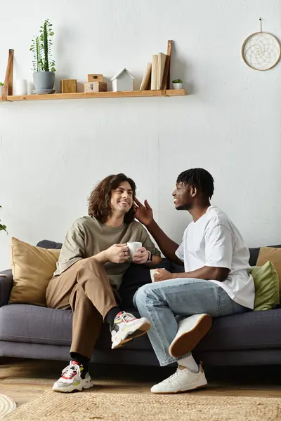A warm exchange between a loving couple over cups in their inviting living room. — Stock Photo