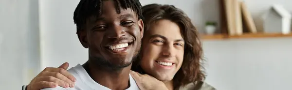Two smiling partners share a warm moment, celebrating love and connection at home. — Stock Photo