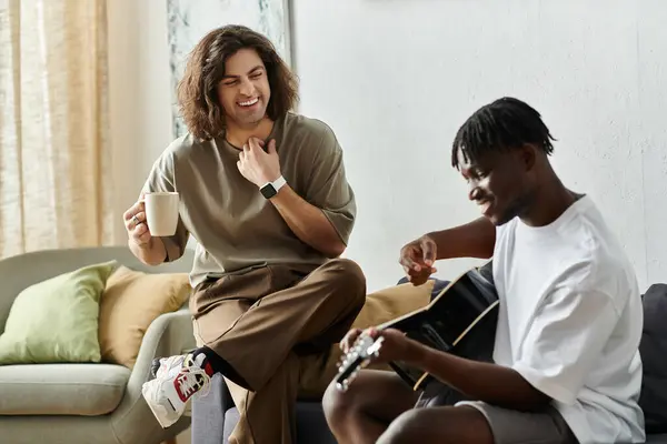Two partners share a joyful moment with music and warmth in their living room filled with love. — Stock Photo