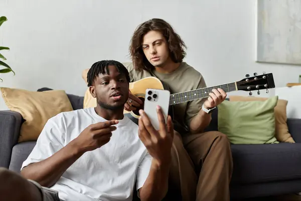 A couple enjoys a warm moment together, sharing music and each other at home. — Stock Photo