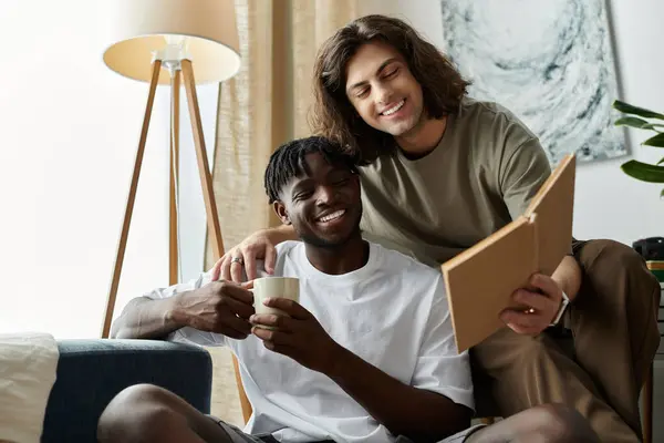 Two partners embrace happiness, enjoying a relaxing afternoon while sharing stories at home. — Stock Photo