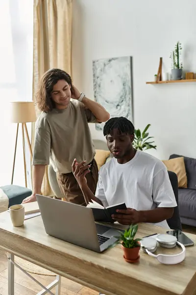 A couple engages in a heartfelt study session, exchanging ideas and smiles in their home. — Stock Photo