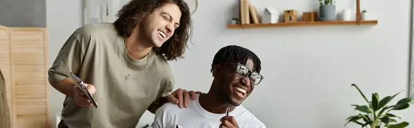 Two partners enjoy each other, laughing together while creating art at home. — Stock Photo