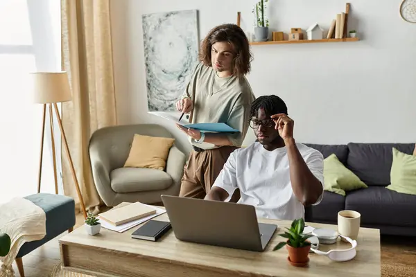 A loving couple shares a productive moment, discussing plans and enjoying their cozy home together. — Stock Photo