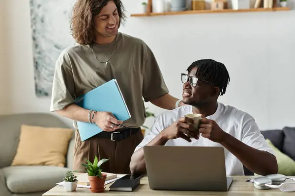 A couple enjoys each other as one shares a warm drink and the other offers support. — Stock Photo